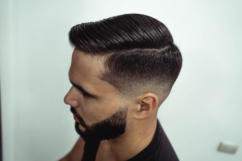 Man receiving a professional fade haircut